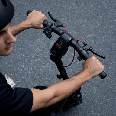 Teenage boy driving a Segway Ninebot MAX G3 