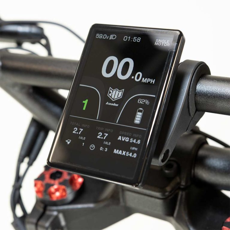 Close-up of an electric scooter’s LED digital dashboard, displaying the current speed in large numerals, a segmented battery-level icon, and